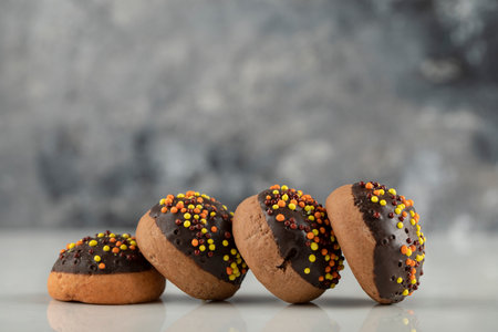 Chocolate sweet doughnuts with colorful sprinkles