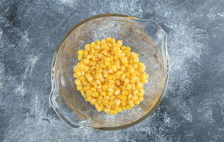 Heap of sweet corns in glass bowl