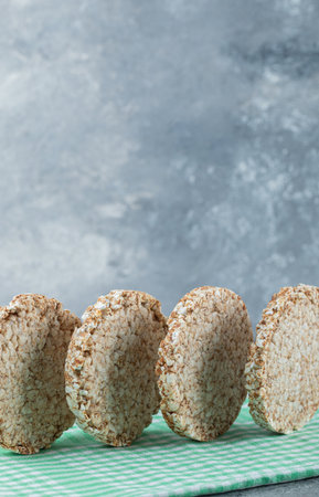 Tasty round rice cakes on striped tableclothの写真素材
