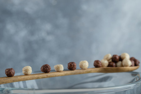 Spoon of cereal balls on marble background