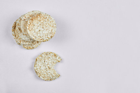 Stack of rice crackers on white backgroundの写真素材