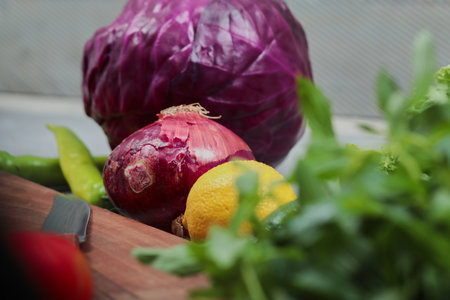 Wooden box of fresh vegetables on gray background. Close upの写真素材