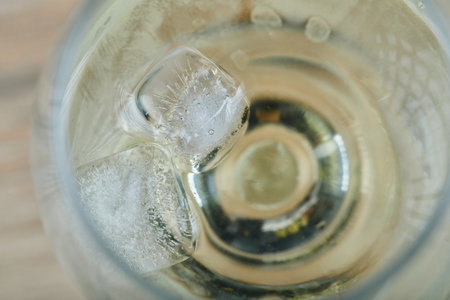 A glass of white wine on wooden background, close upの写真素材