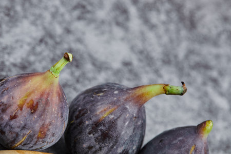 Purple ripe figs on a marble backgroundの写真素材