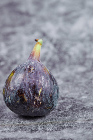 Ripe purple fig on a marble backgroundの写真素材