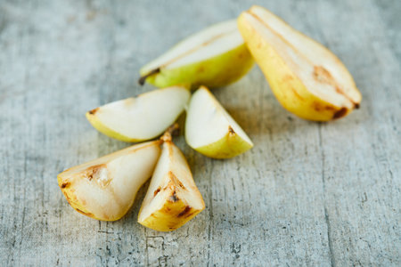 Slices of ripe pears isolated on grey backgroundの写真素材