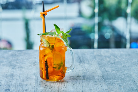 Juicy lemonade with straw and mint on the marble backgroundの写真素材