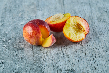 Cut ripe nectarines on marble backgroundの写真素材