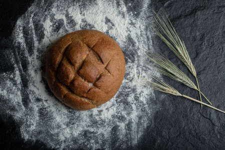 Fresh rye bread with wheat. on flourの写真素材