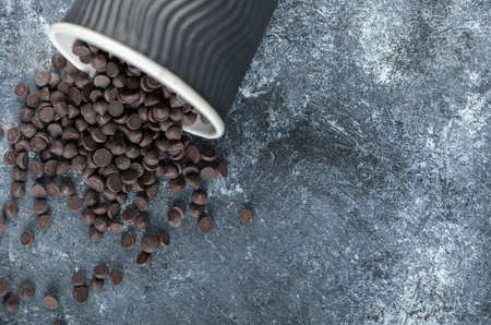 Top view of small chocolate on grey background