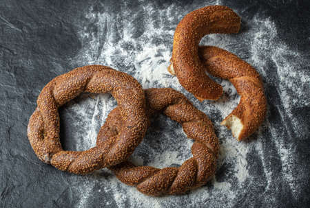 Fresh tasty Turkish simit whole or half cutの写真素材
