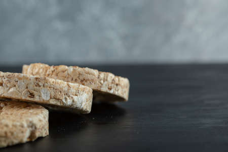 Pile of crispy rice cakes on dark backgroundの写真素材