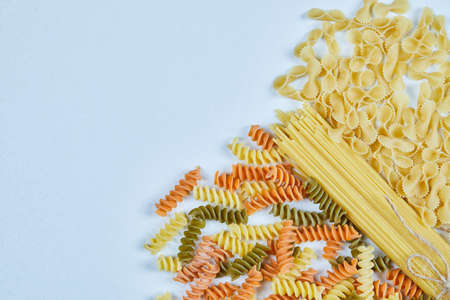 Assorted types of pasta on blue backgroundの写真素材