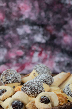 Chocolate and butter cookies in a square wooden board
