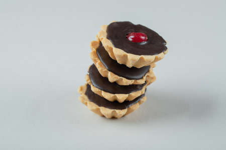 Tartalettes with chocolate ganache and red cherryの写真素材