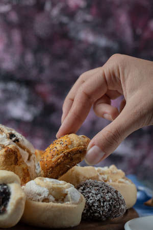 A chef holding butter cookies in the hand