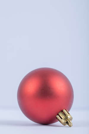 A red glittering or shining oak tree ball on a white backgroundの写真素材