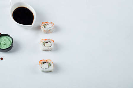 Sushi rolls with red caviar served with soy and wasabi sauce