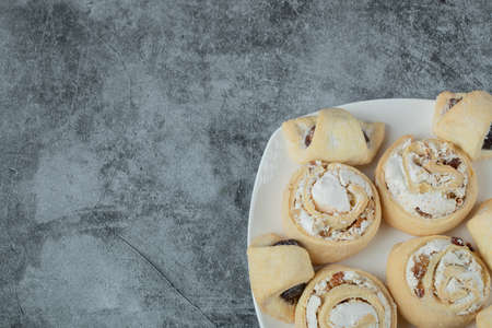 Caucasian traditional cookies with sugar powder in a white ceramic plateの写真素材