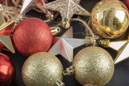Mix of colorful oak tree ornaments on a dark background