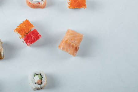 Maki sushi rolls with red caviar isolated on white background