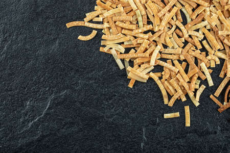 Cooking Italian pasta concept. Bunch of raw yellow spaghetti