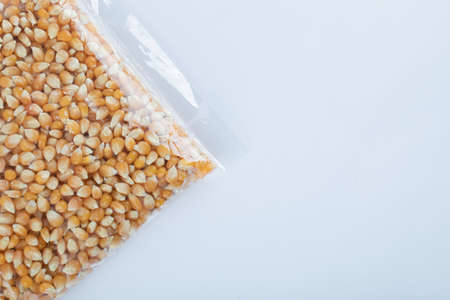 Heap of raw popcorn grains texture backgroundの写真素材