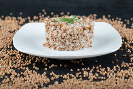 Delicious buckwheat with greens on a white plateの写真素材