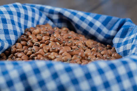 Many of dried raw brown kidney beans on a tableclothの写真素材