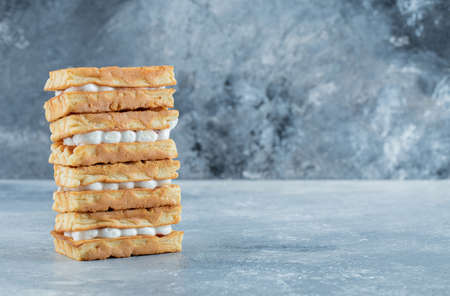 Delicious fresh waffles on a gray background