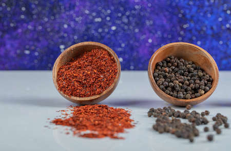 Clay bowls of dried pepper and red pepperの写真素材