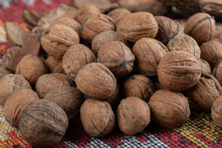 Heap of healthy walnuts on a tablecloth