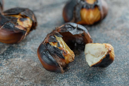 Delicious fried chestnuts on a gray backgroundの写真素材