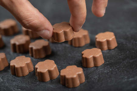 Some of chocolate candies on a dark background