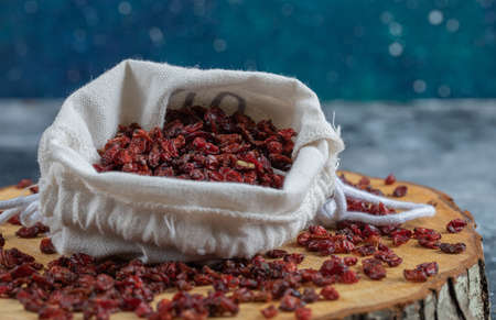 A wooden board full of dried cranberries. High quality photoの写真素材