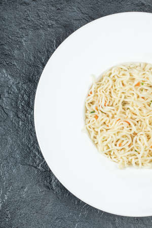 A white plate full of delicious noodles pasta. High quality photo