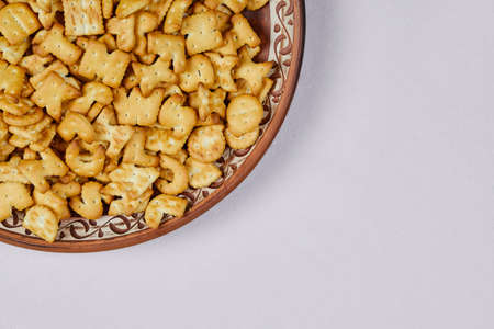Alphabet crackers on a ceramic plateの写真素材