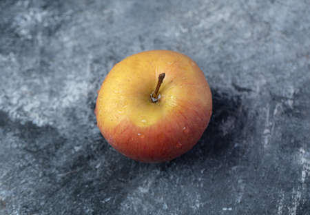 A fresh red apples on a marble backgroundの写真素材