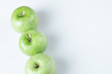 Juicy apples isolated on a white backgroundの写真素材