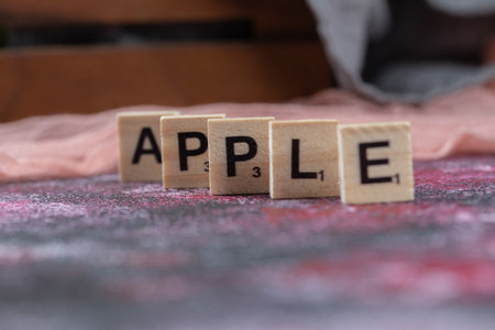 Apple word written with wooden dicesの写真素材