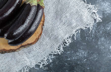 Close up photo of fresh raw purple eggplantsの写真素材