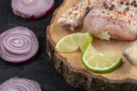 Close up Raw chicken legs on Wooden board