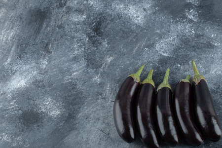 Fresh ripe eggplants on grey backgroundの写真素材