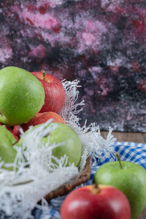 Red and green apples on blue checked kitchen towelの写真素材