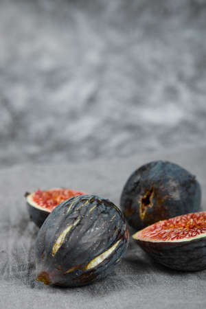 Ripe delicious figs on marble backgroundの写真素材