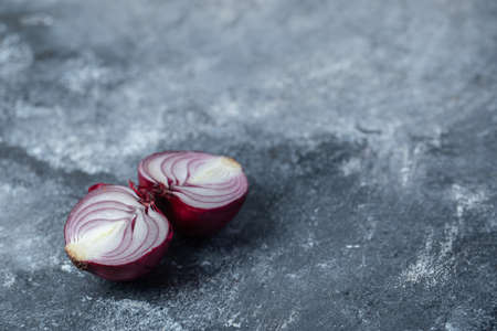 Sliced purple onion on a marble backgroundの写真素材