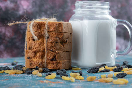 Sliced sultana pie with a jar of milk