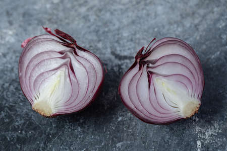 Sliced purple onion on a marble background