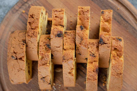 Soft pie slices with black sultana on a wooden boardの写真素材