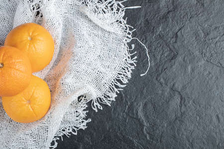 Fresh orange fruits isolated on a black backgroundの写真素材